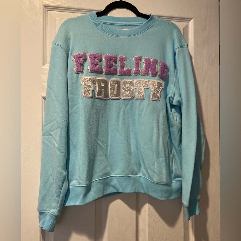Feeling Frosty Light Blue Sweatshirt with Purple Lettering
